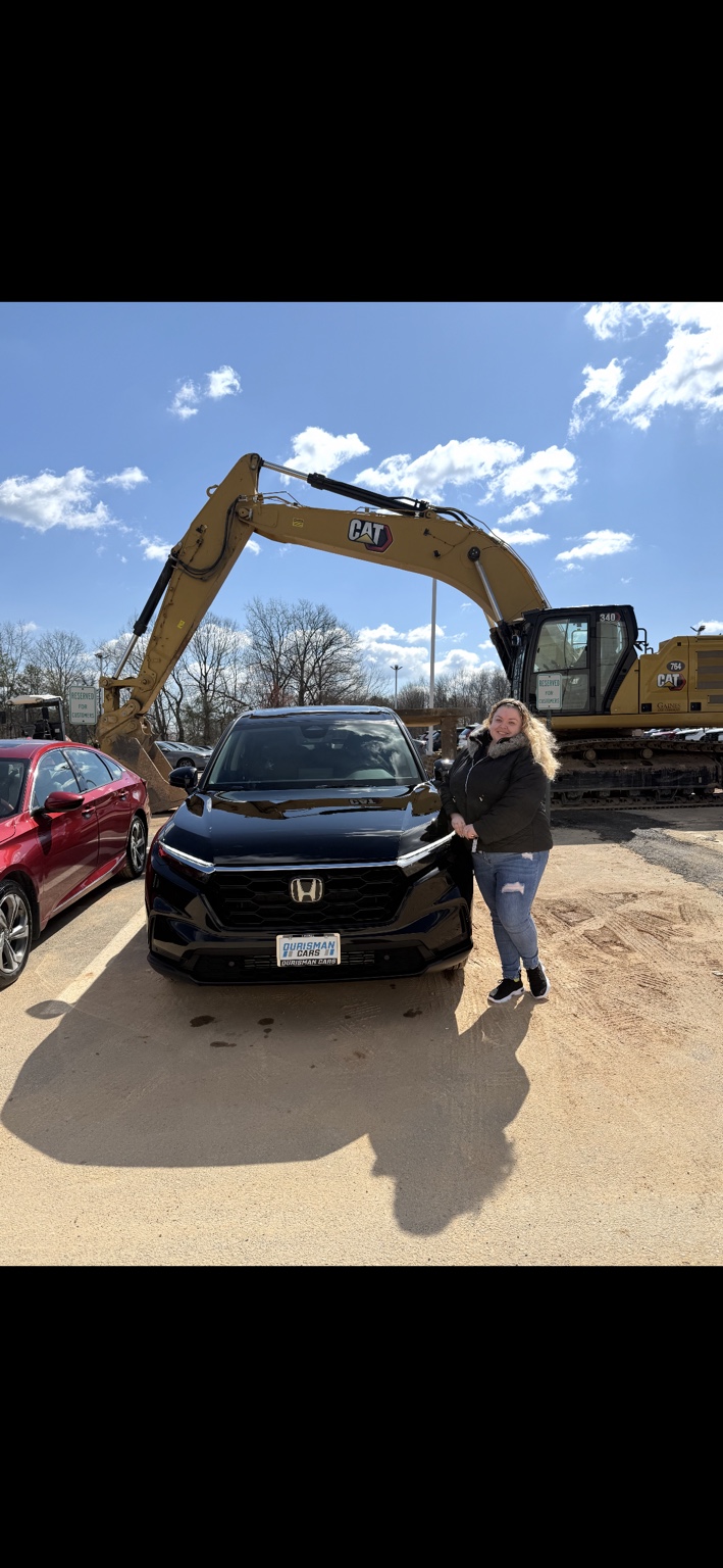 Customer beside a black Honda SUV