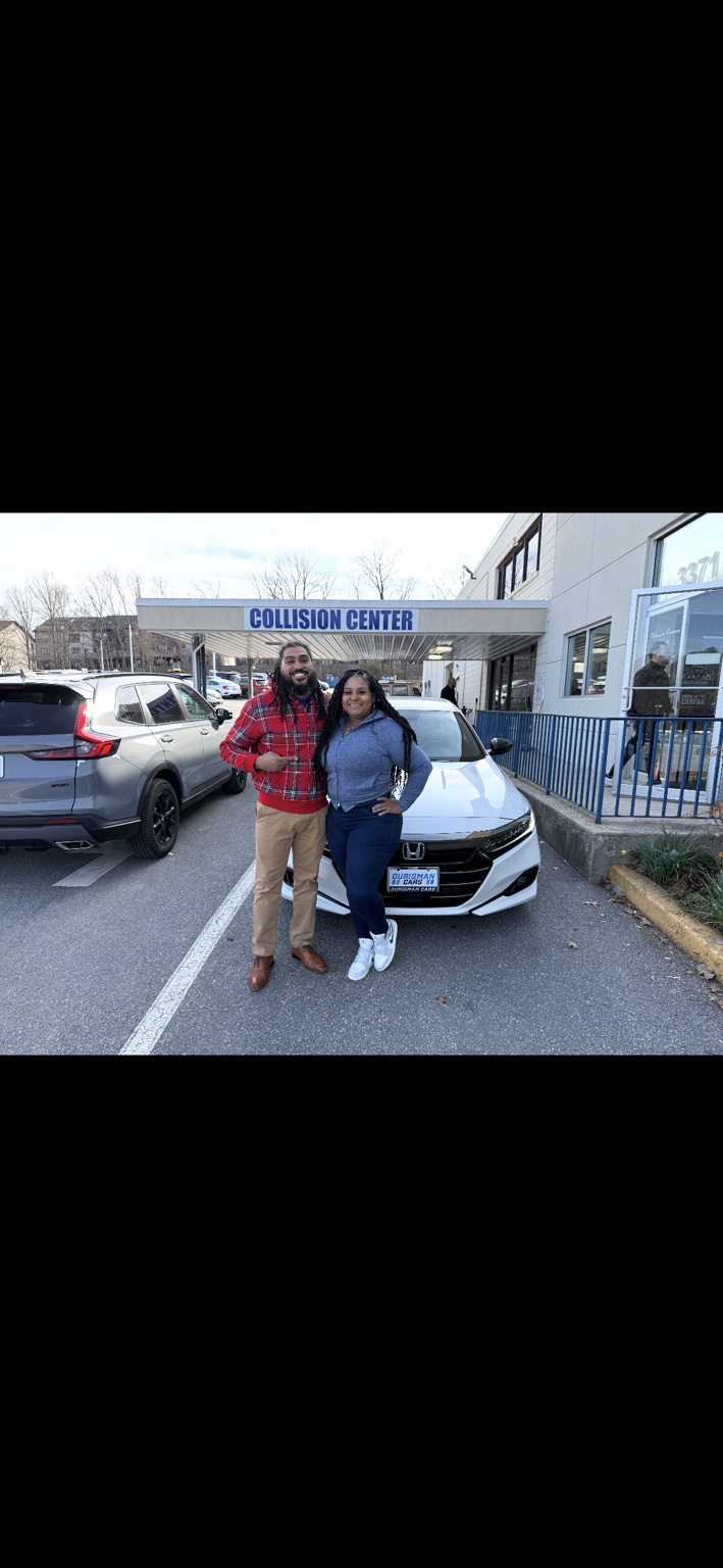 Customer and Jamel beside a white Honda sedan